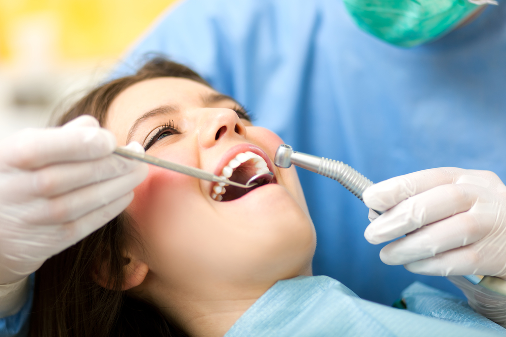Dentures clinic in London Ontario 3 Dentist checking the fit of a new denture during a fitting appointment