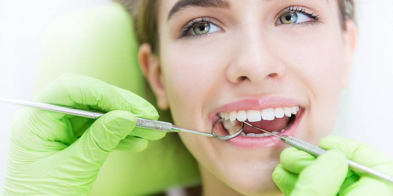 Dental Veneers in London Ontario 3 Checking and polishing dental veneers during a routine hygiene visit