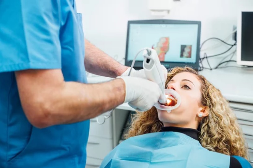 Dental Veneers in London Ontario 4 Dentist reviewing a digital smile design with a patient before dental veneers