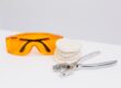 Safety glasses, a dental model and extraction forceps prepared for after-hours dental pain in London, Ontario
