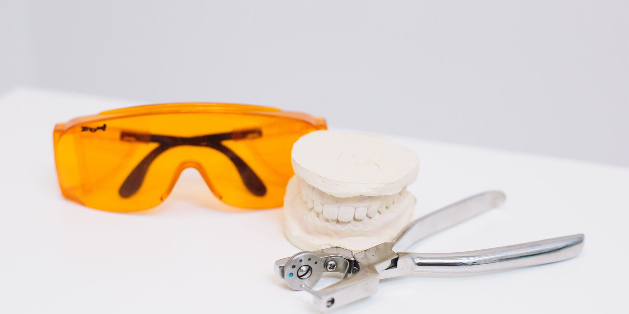 pexels-polina-zimmerman-4687403 Safety glasses, a dental model and extraction forceps prepared for after-hours dental pain in London, Ontario