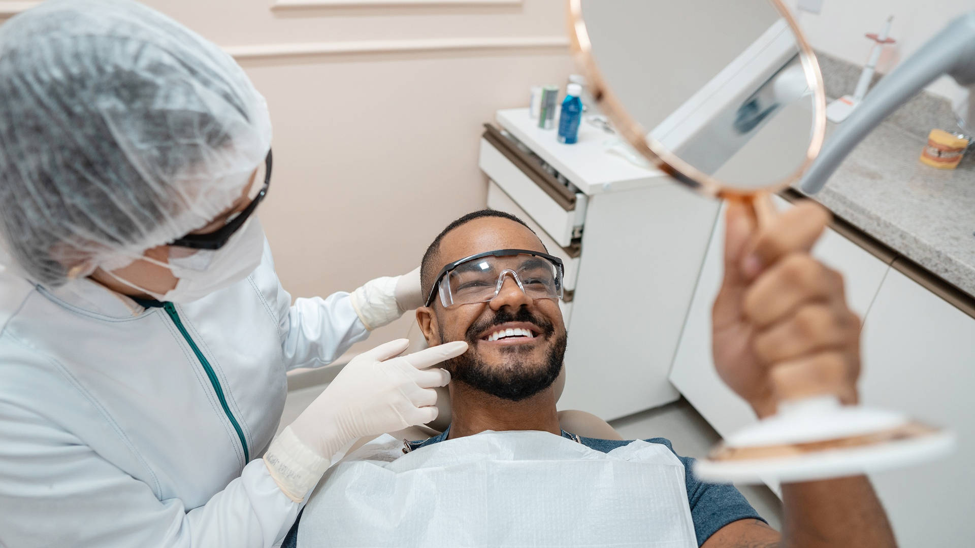 Reliable Dentists in London Ontario | Local Dental Clinic Near You 8 Dentist examining a patient during a routine checkup in London, Ontario