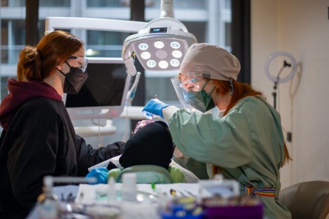 pexels-photo-19879759 Dentist welcoming a patient for a new patient dental visit in London, Ontario
